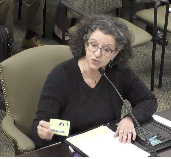 Gail Shows a fentanyl test strip while testifying in Harrisburg, January 10, 2022.